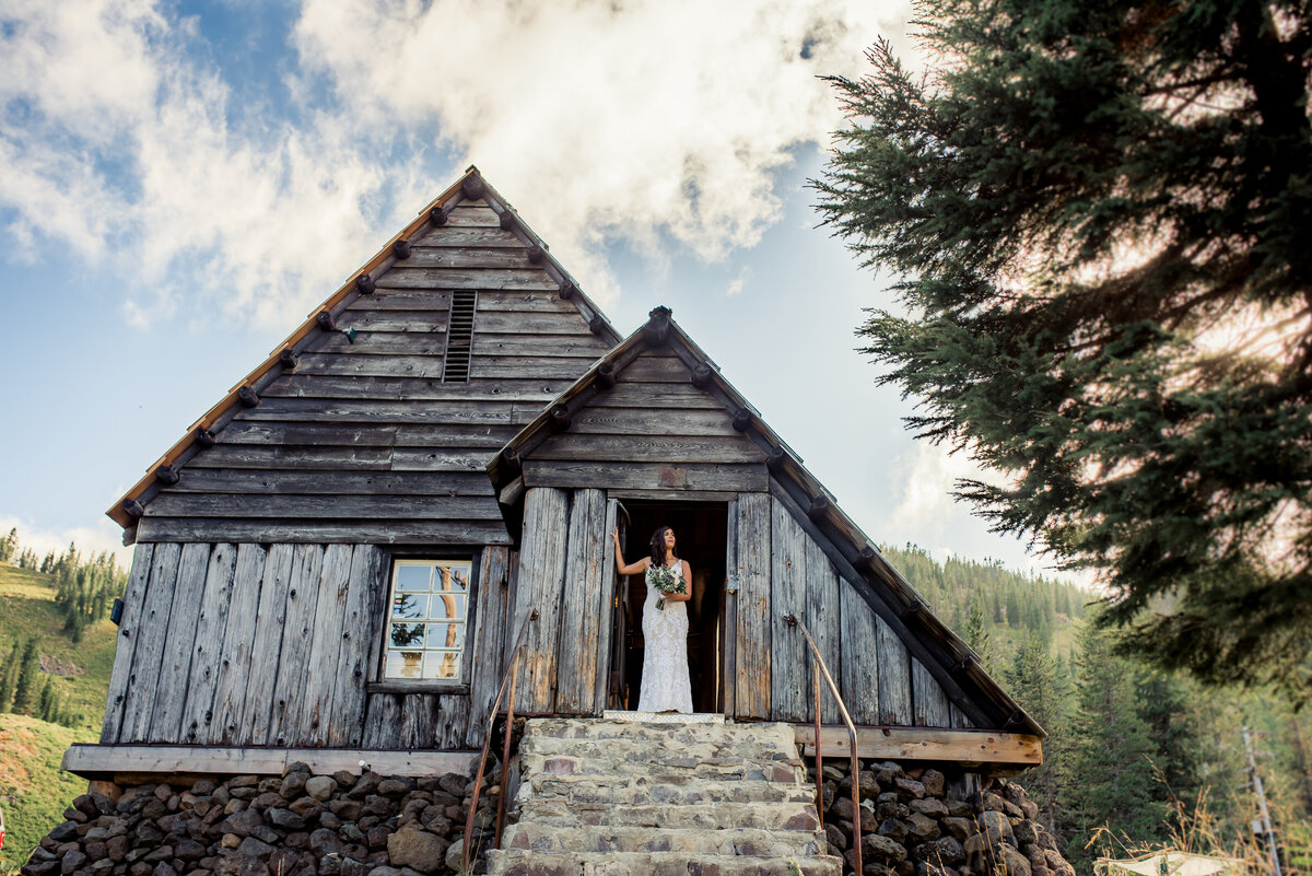 bride in doorway of old building