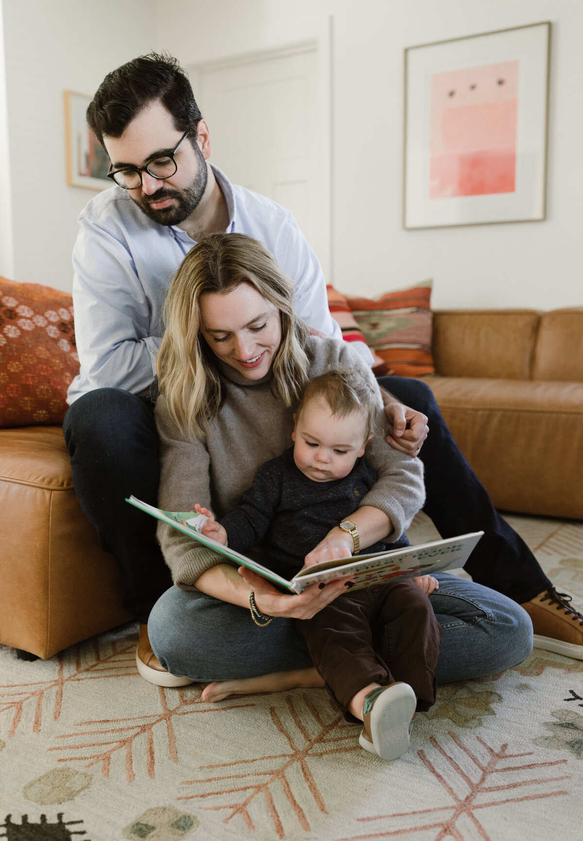 Mother and father reading to baby  at Austin family photo session