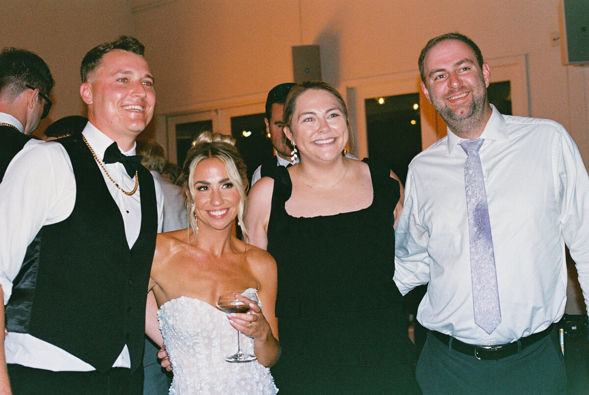 Film photograph of a Tampa Florida photographer at work, capturing candid moments during a wedding reception.
