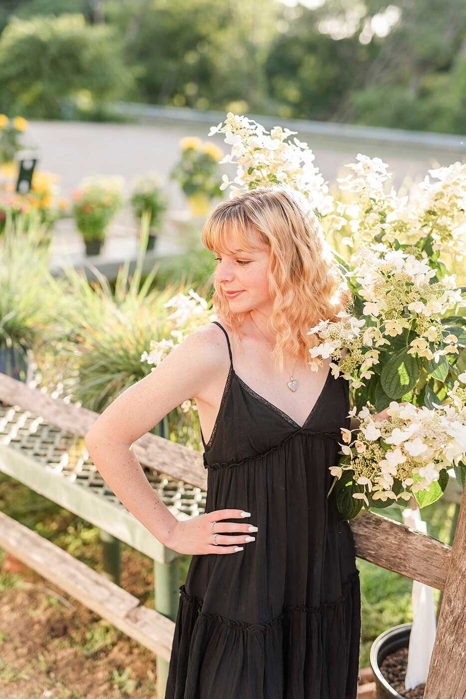 Sunset photo of high school girl in flower field