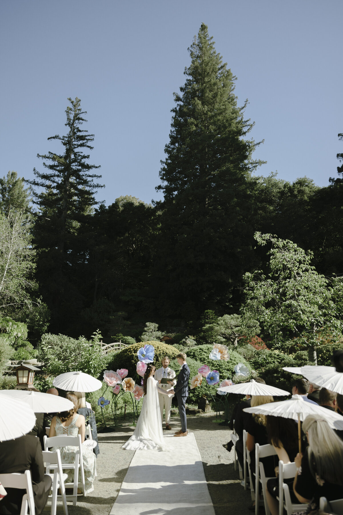 Bride and Groom posing in tea garden