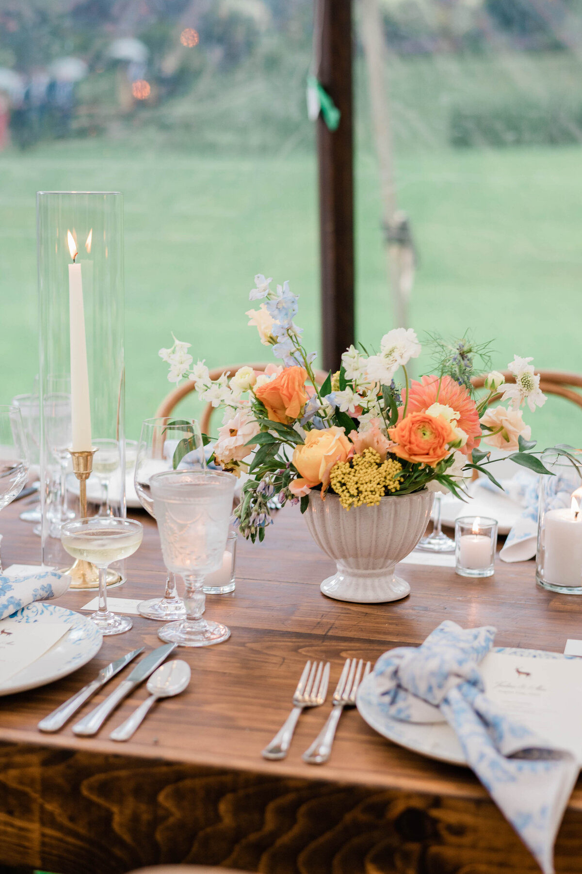 Orange and yellow florals on the reception table 