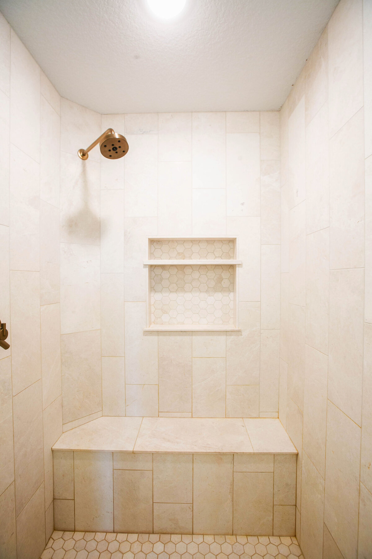 Custom bathroom with soaking tub, double vanity, and walk-in shower in Otsego custom home