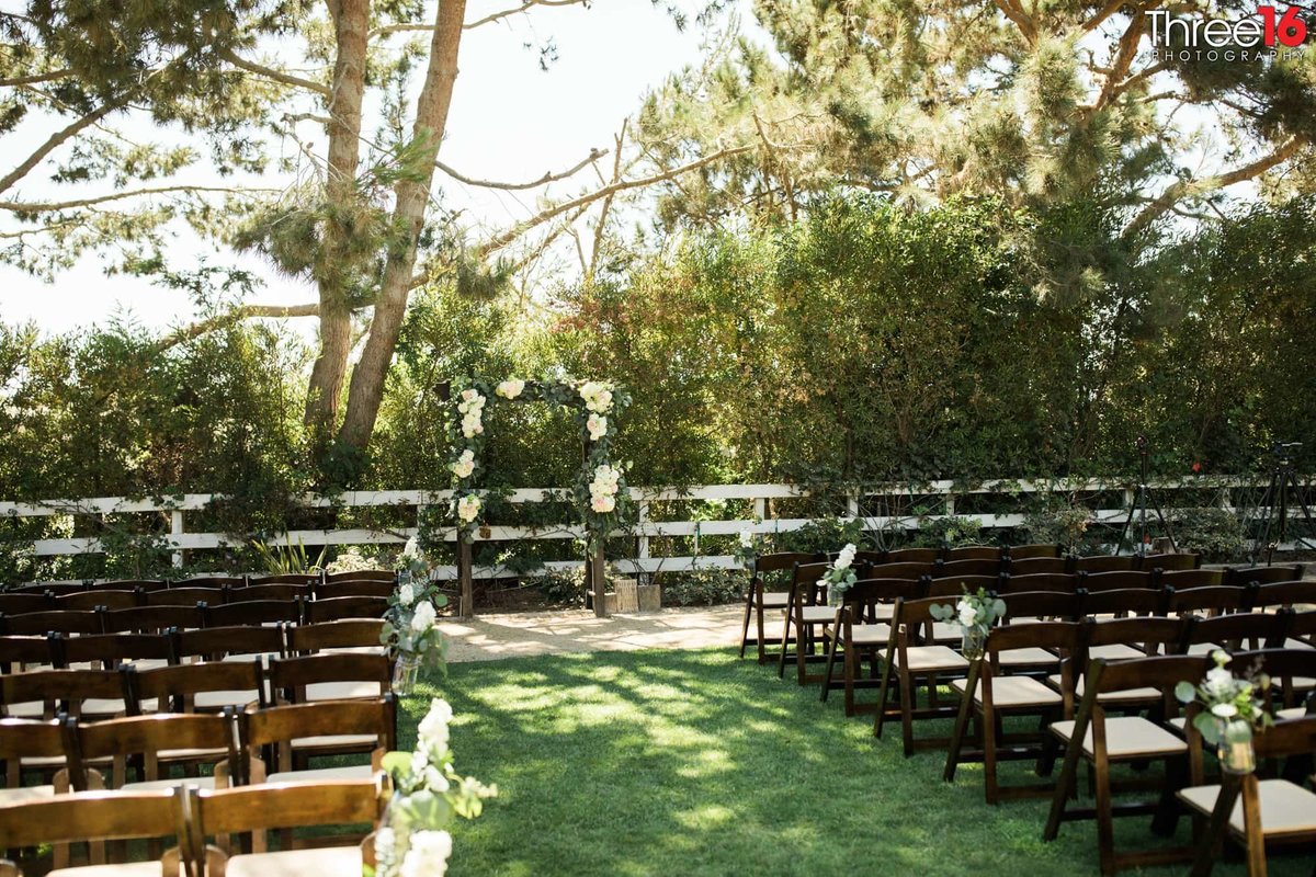 Outdoor seating is in place for a Red Horse Barn wedding ceremony