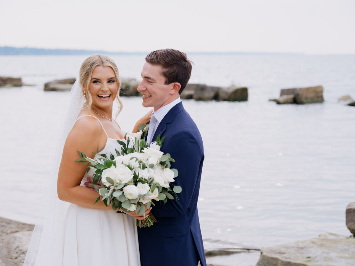 Bride and groom with lake in the background at Cleveland Yachting Club