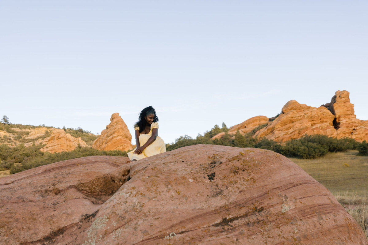 Vacation photo session at a Denver mountains, with golden hour lighting and a dramatic Colorado mountain backdrop.