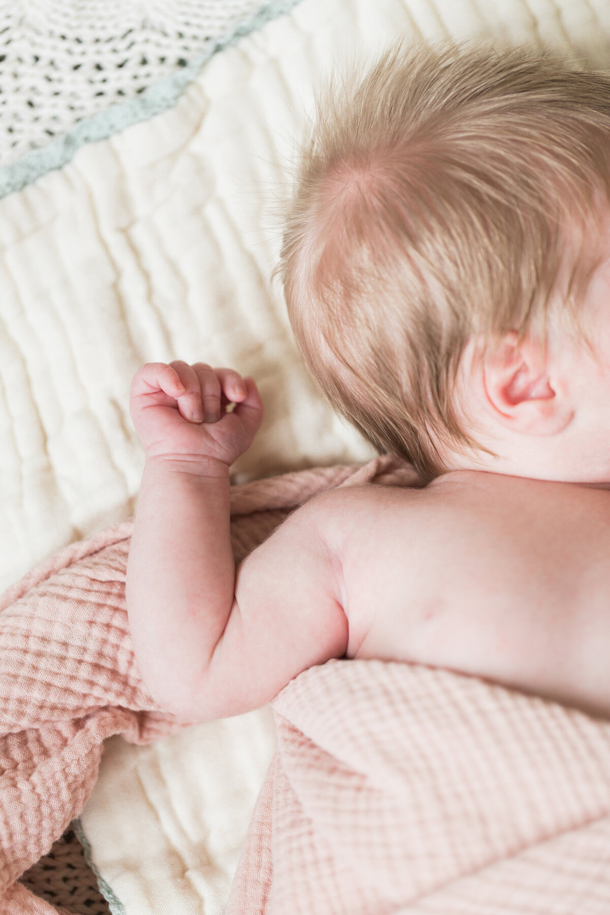 Close up of baby wrinkles and hand