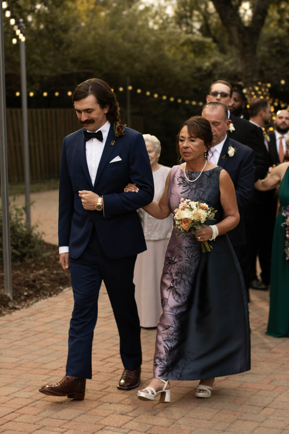 Mother prepares to walk her son down the isle