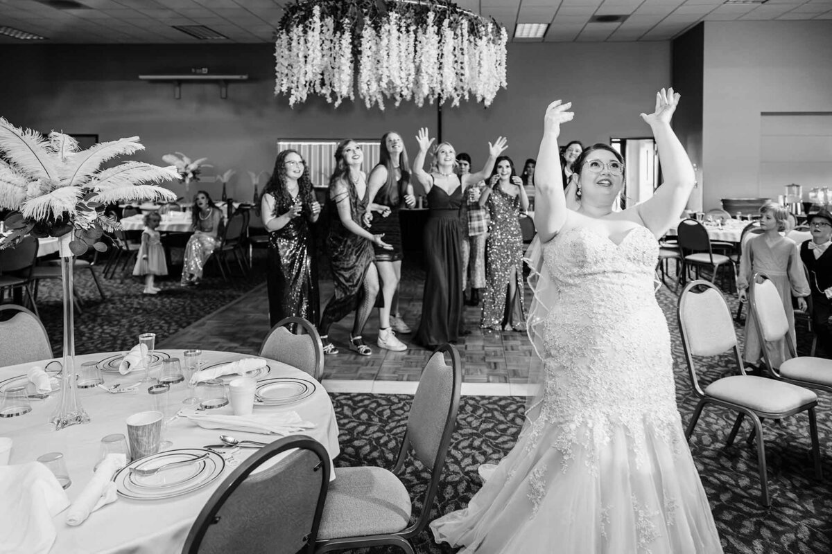 Bride tossing her bouquet at Broadway River Inn in Hamilton, MT