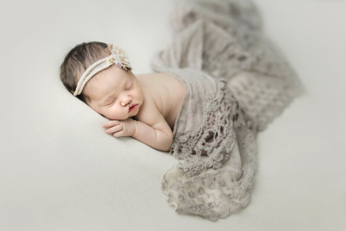 newborn sleeps during photoshoot at NJ photo studio
