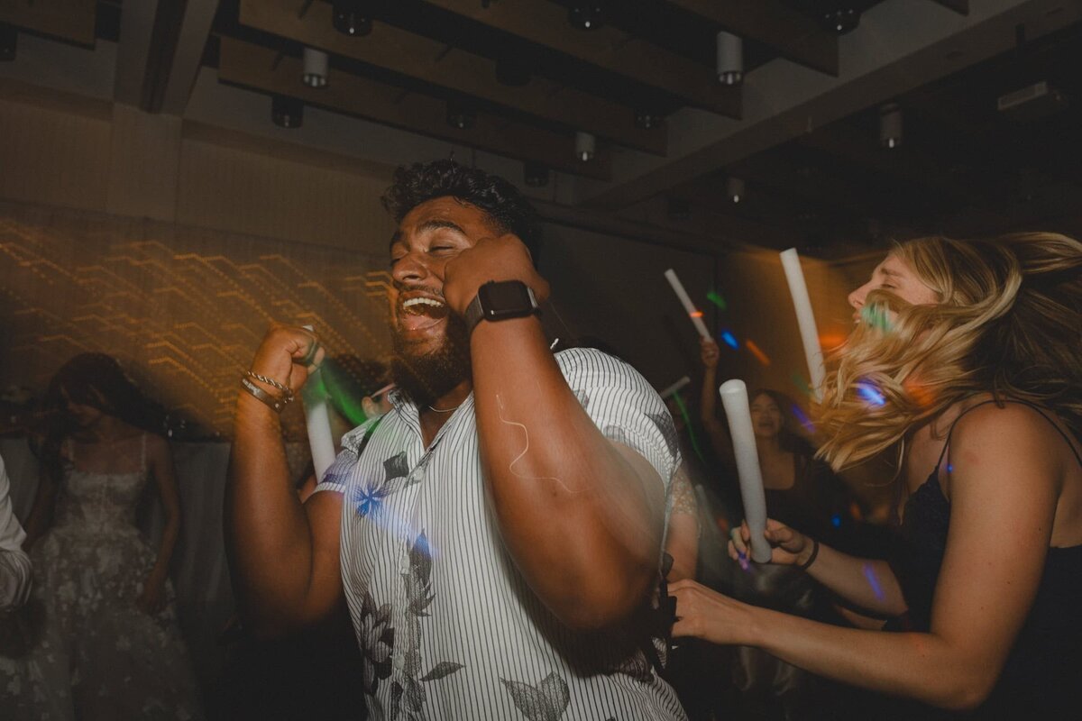 Man dances on a wedding dance floor