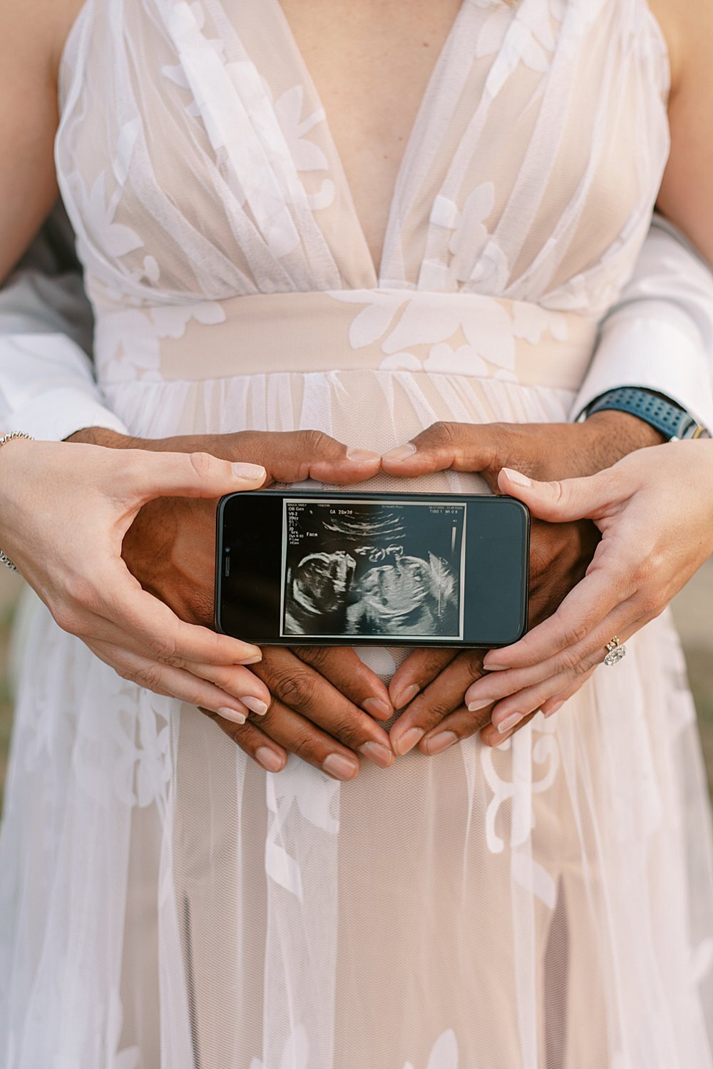 portrait of parents holding an ultrasound