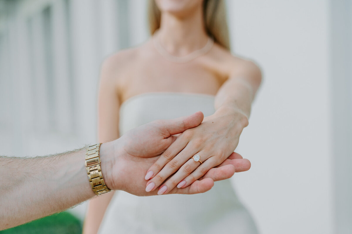 hand wearing engagement ring