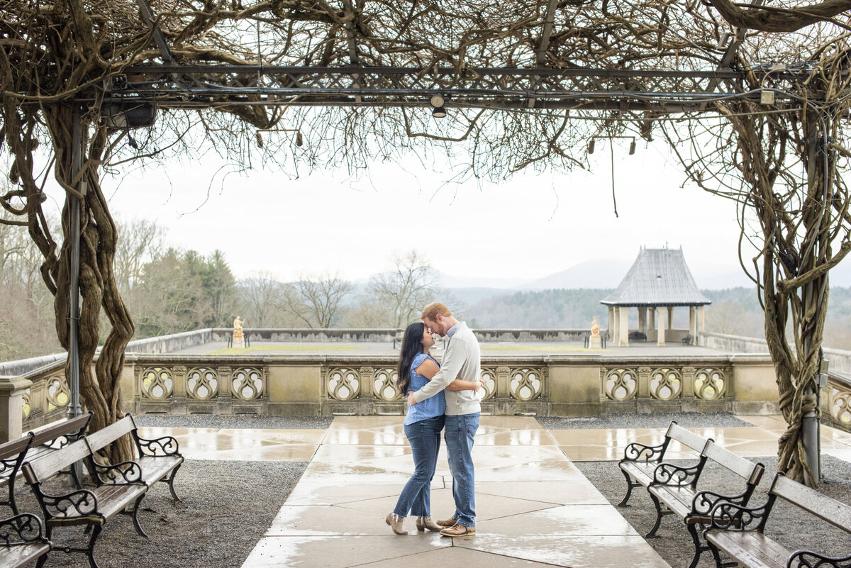 Couple touching foreheads Asheville, NC engagement proposal Biltmore Estate