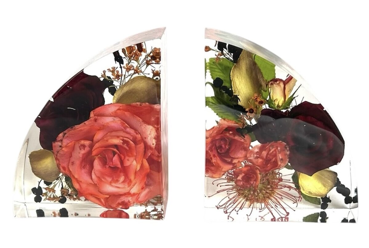 bookend resin block with burgundy and bright orange wedding bouquet and grooms boutonniere preserved as a family heirloom