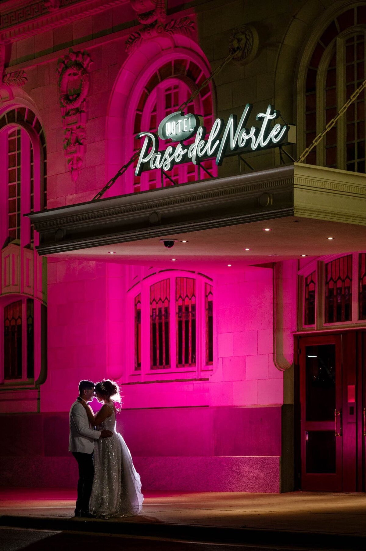 bride and groom in front of paso del norte hotel In el paso texas