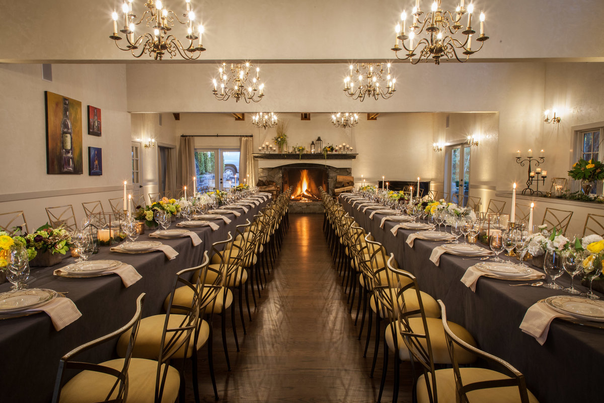 Chateau Lill elegant dinner tables for corporate party event with long tables and silver Chameleon chairs with yellow cushions