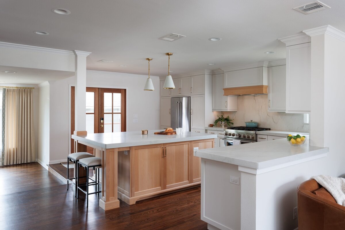 the keeping room interiors oakview kitchen with white island dark wood flooring