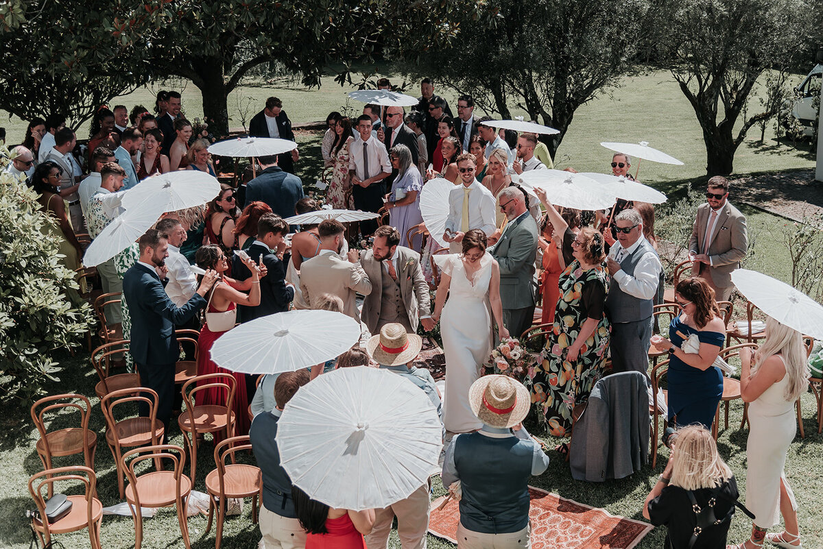 Bride and Groom walking back down the aisle after their wedding in Portugal. Photo taken from above through a window