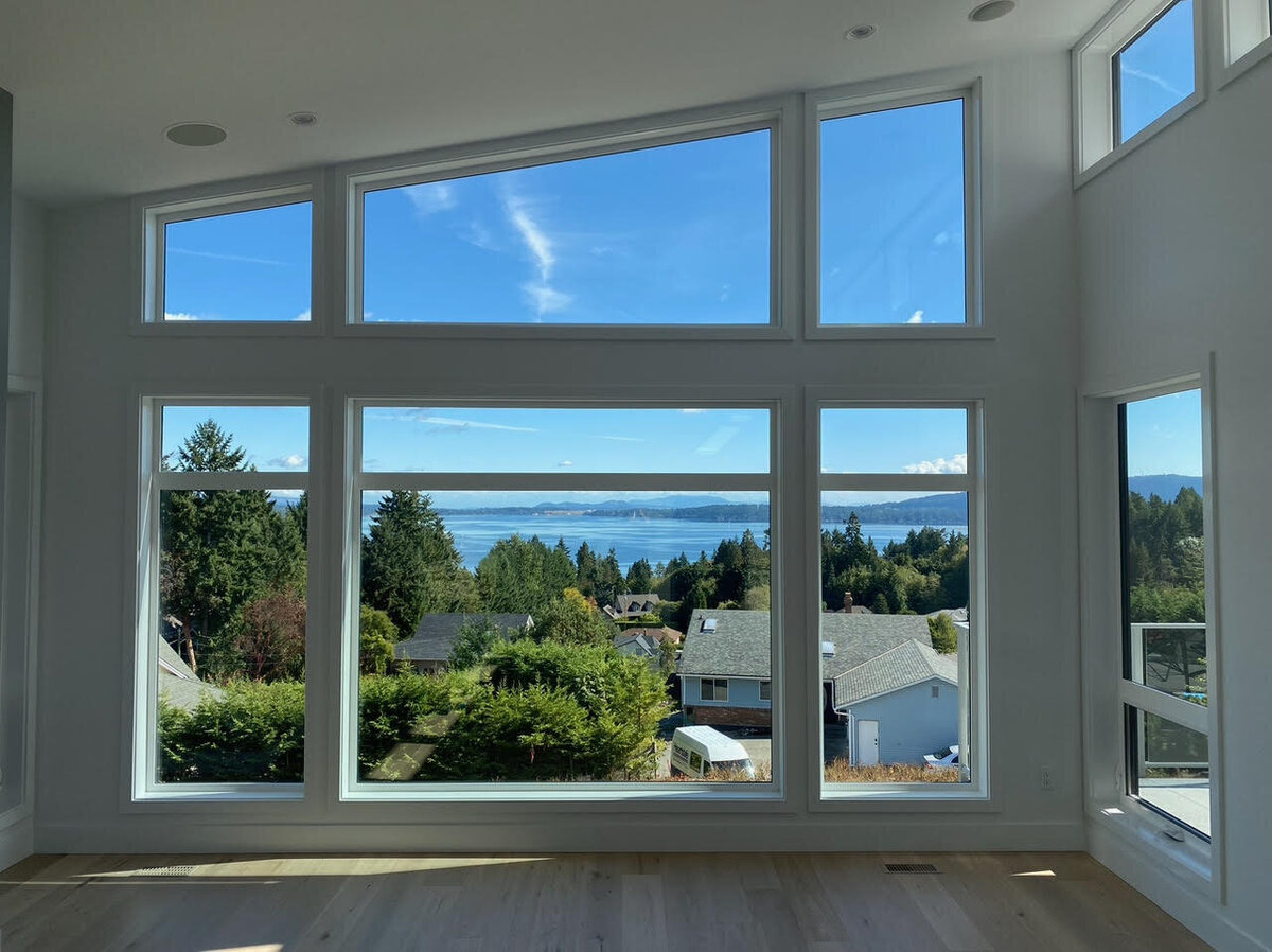 Modern home design with vaulted ceilings, angled windows, and ocean views in Mill Bay, BC.