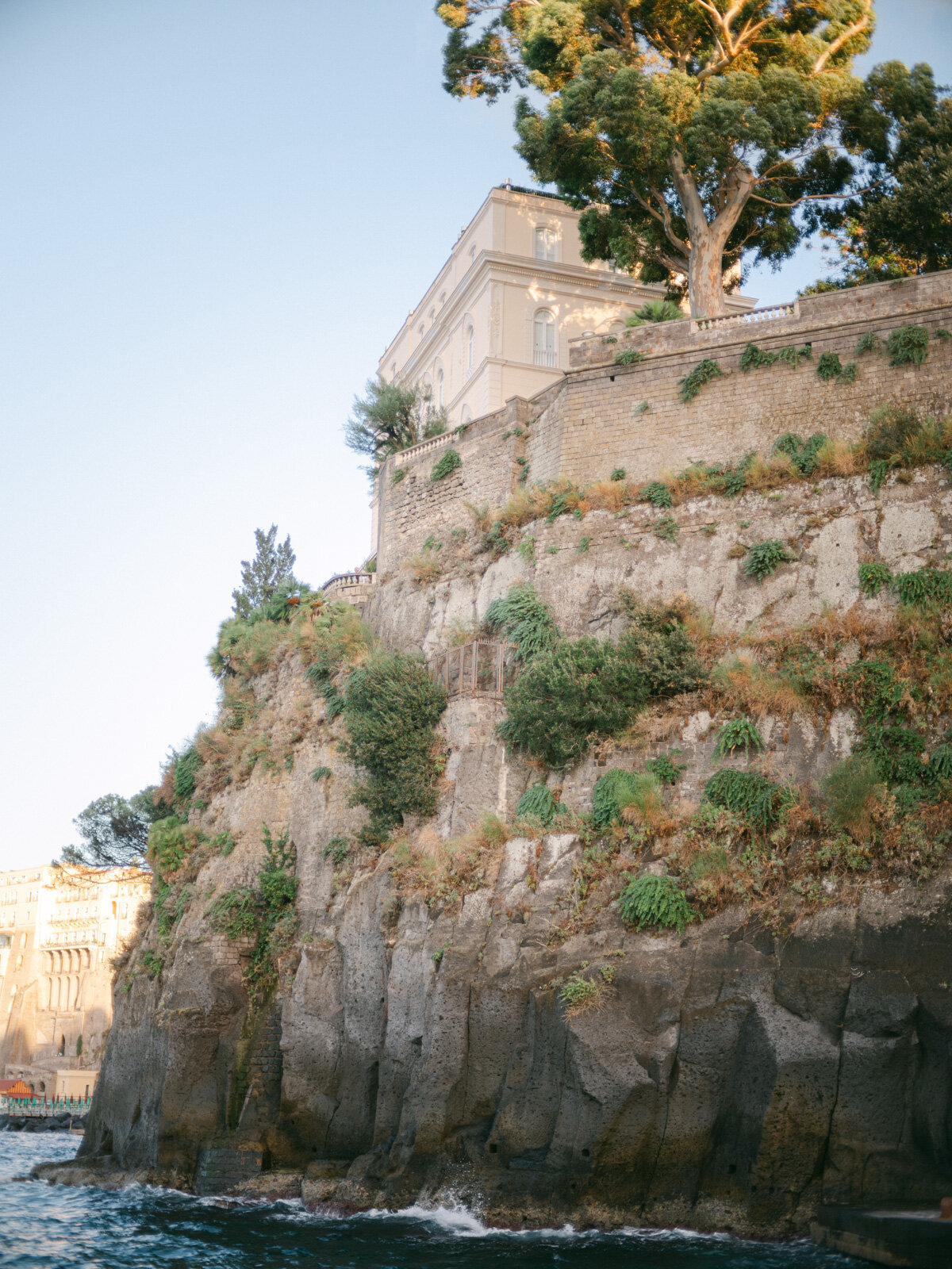 Elegant villa perched on cliffs above the sea in Sorrento, offering breathtaking views for luxury weddings on the Amalfi Coast.