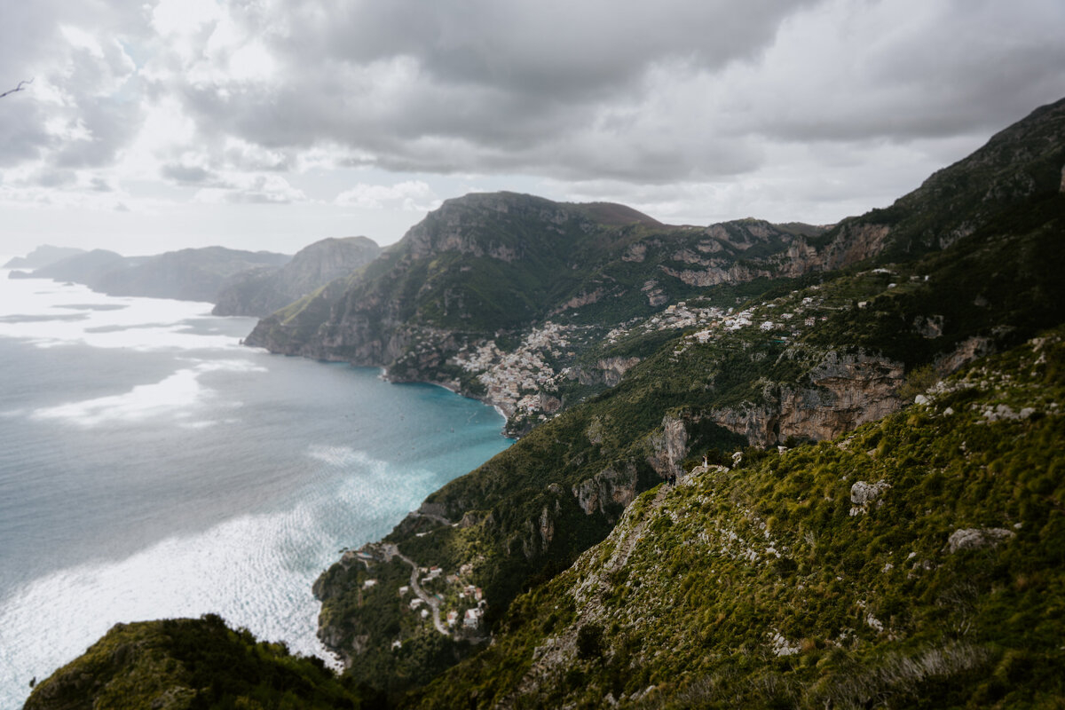 Aerial view of Amalfi Coast cliffs and sea.