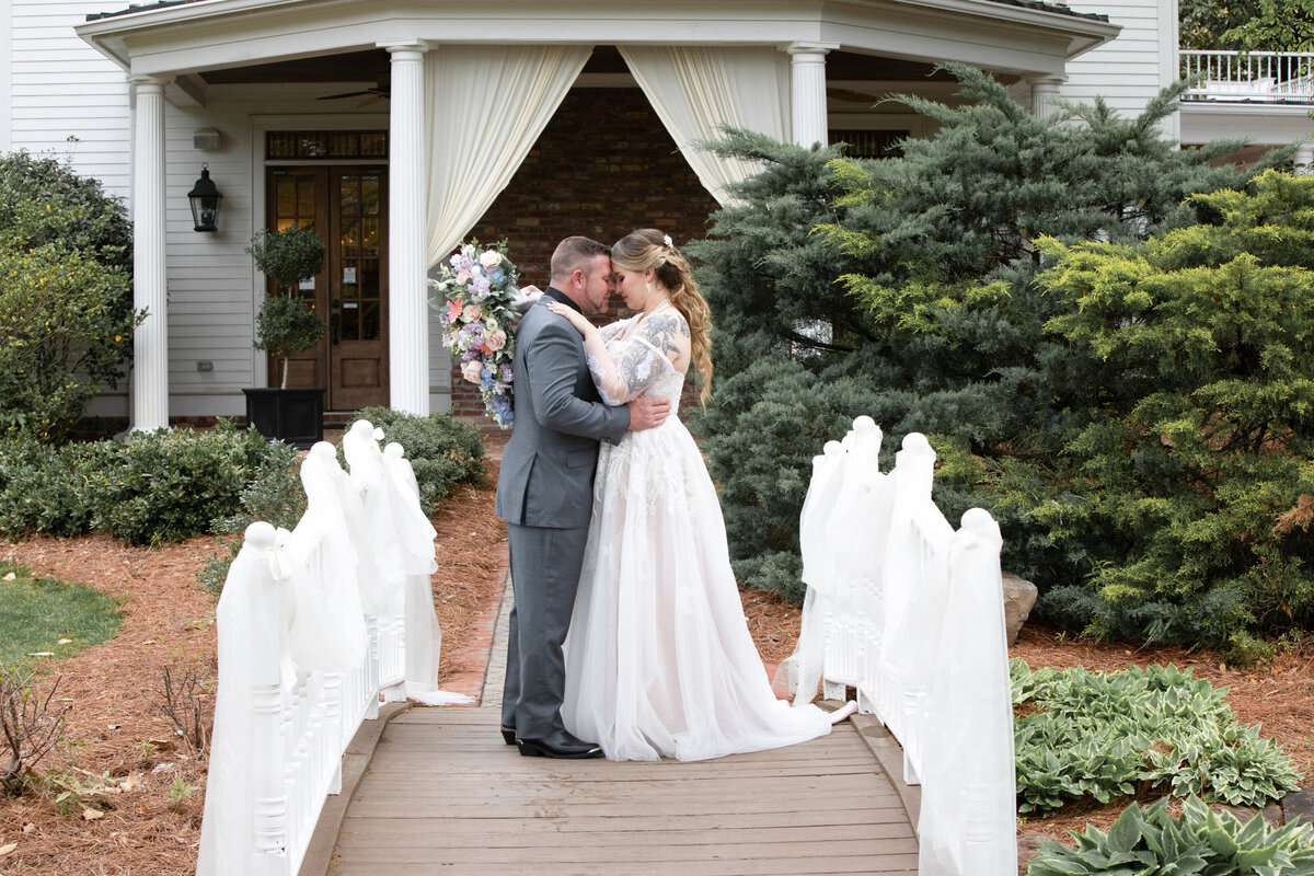 Carl-House-Auburn-GA-Bride-Groom-Embrace-Bridge-Wedding-Portrait