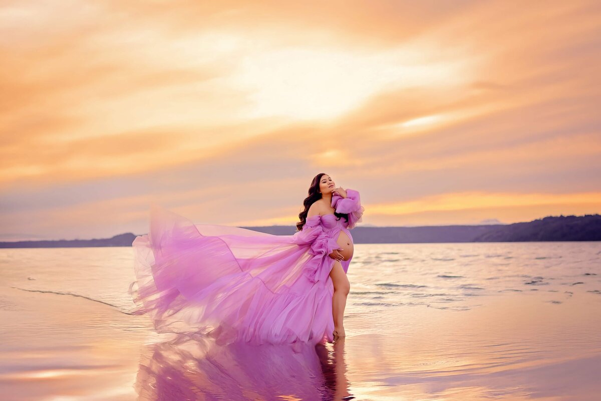 Sunset beach maternity with pink flowing dress