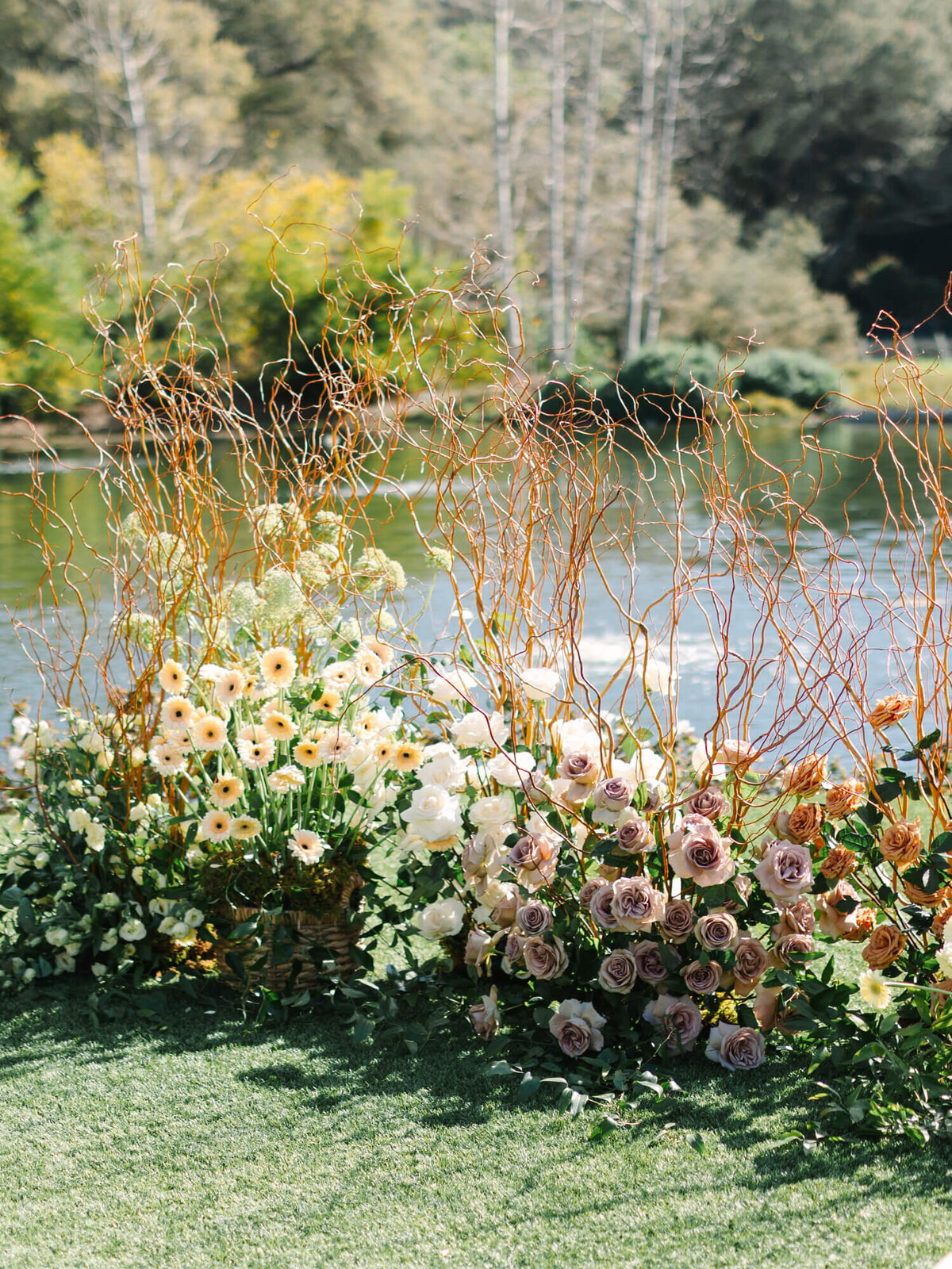 flower arrangements of ceremony site by the lake in san diego wedding venue