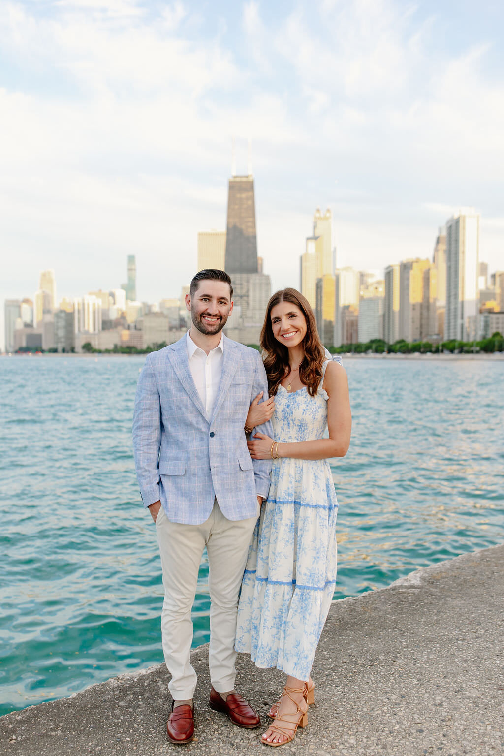 An engagement photography session at The Wrigley Building and North Ave Beach in Chicago, Illinois - 24