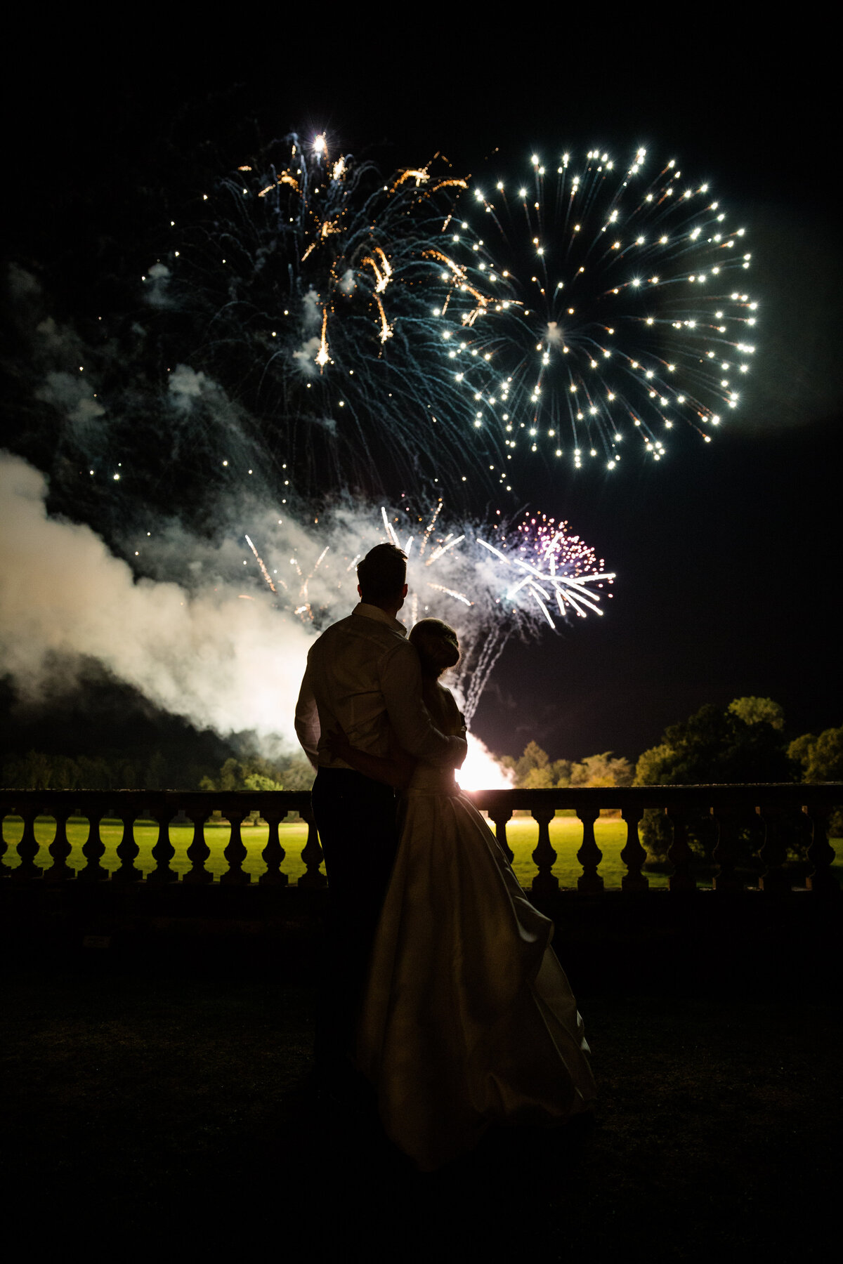 Bride and Groom watching a fireworks display