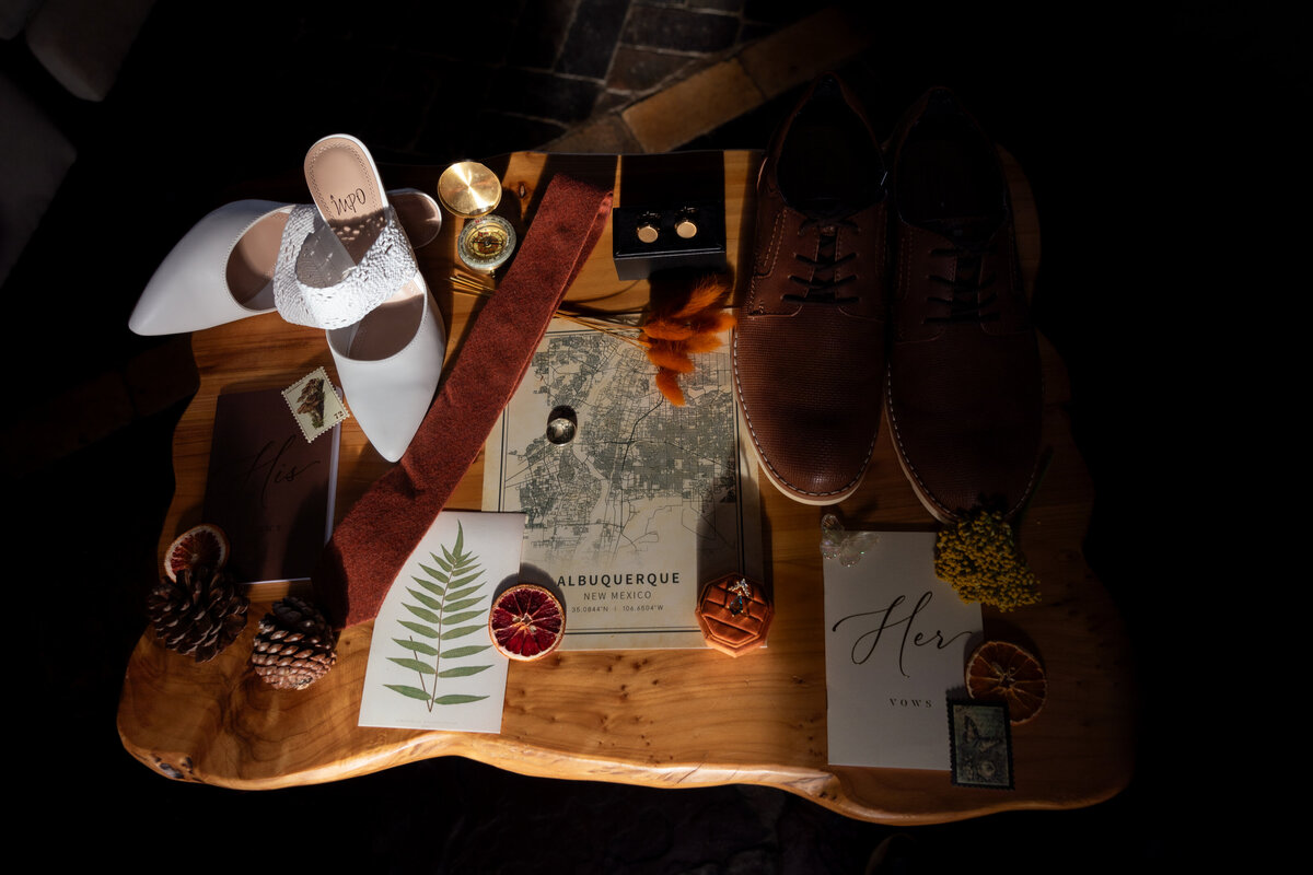 Adventure-inspired elopement flat lay with a map, captured by Lamblight Photography in New Mexico