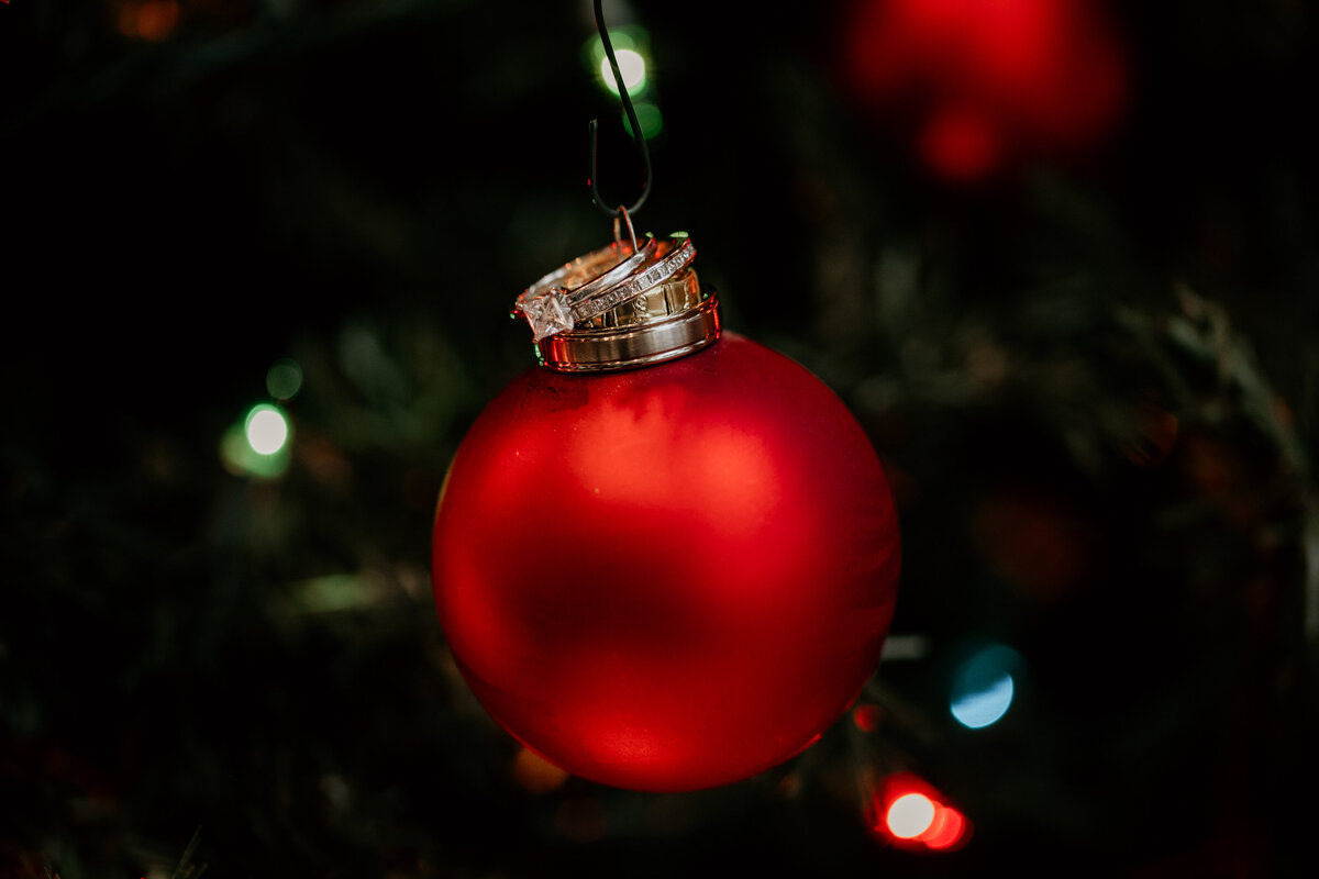 wedding rings on a Christmas ornament