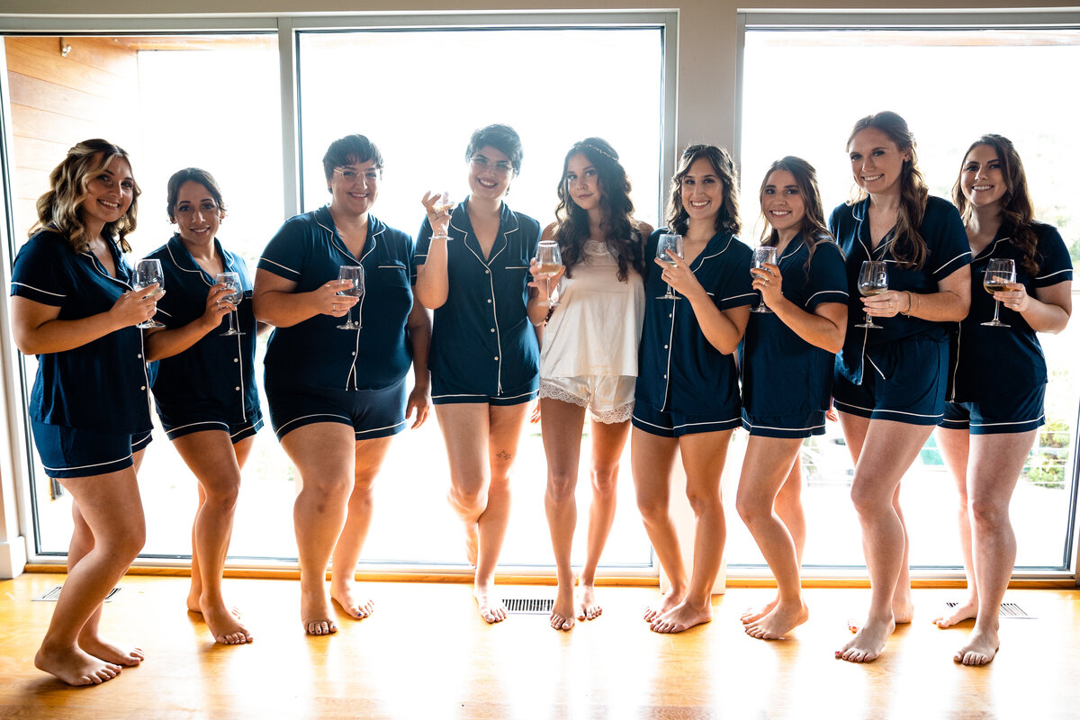 Photograph of a bridal party at Saltwater Farm VIneyard in Stonington Connecticut.