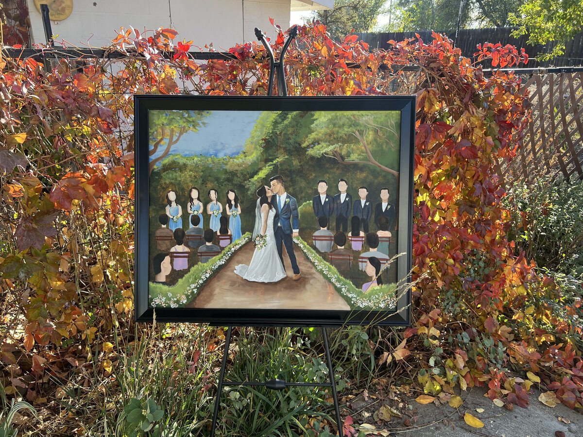 A live wedding painting featuring a bride and grooms first kiss. Audience and bridal party are included in this luxury diamond package.