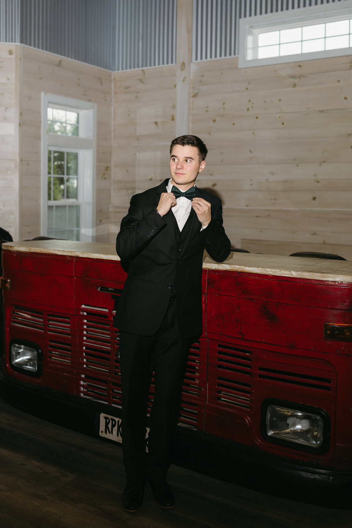 Christian getting ready for his wedding day at Howe farms!! They have an entire grooms lounge located at the Bow tie club at howe farms!!