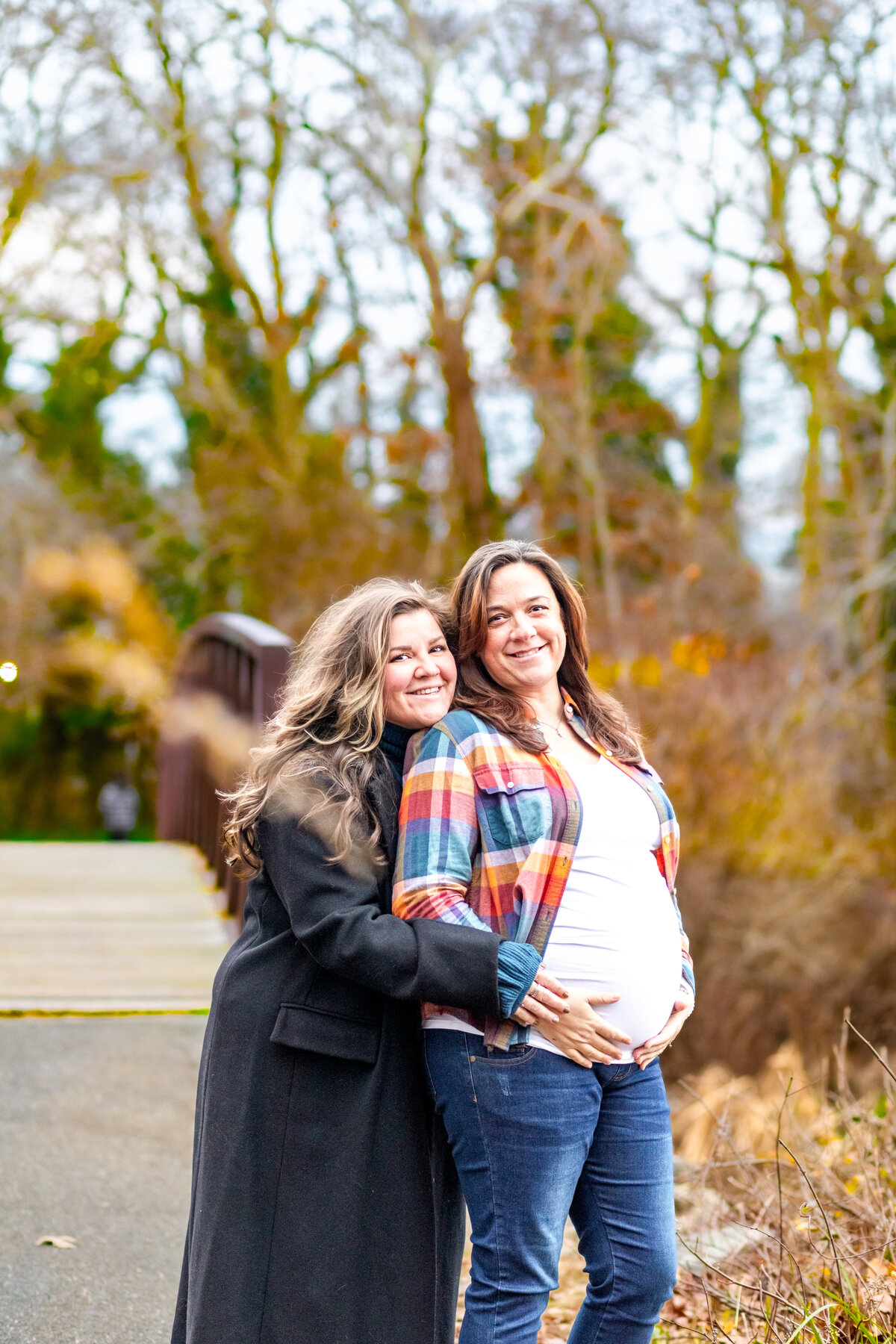 Two woman-posing-pregnancy-announcement