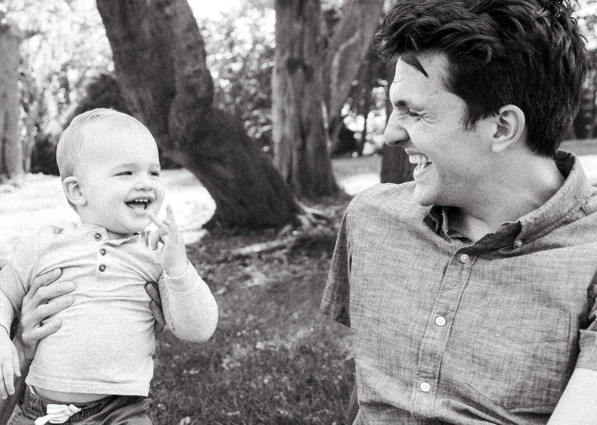 baby laughing with dad 