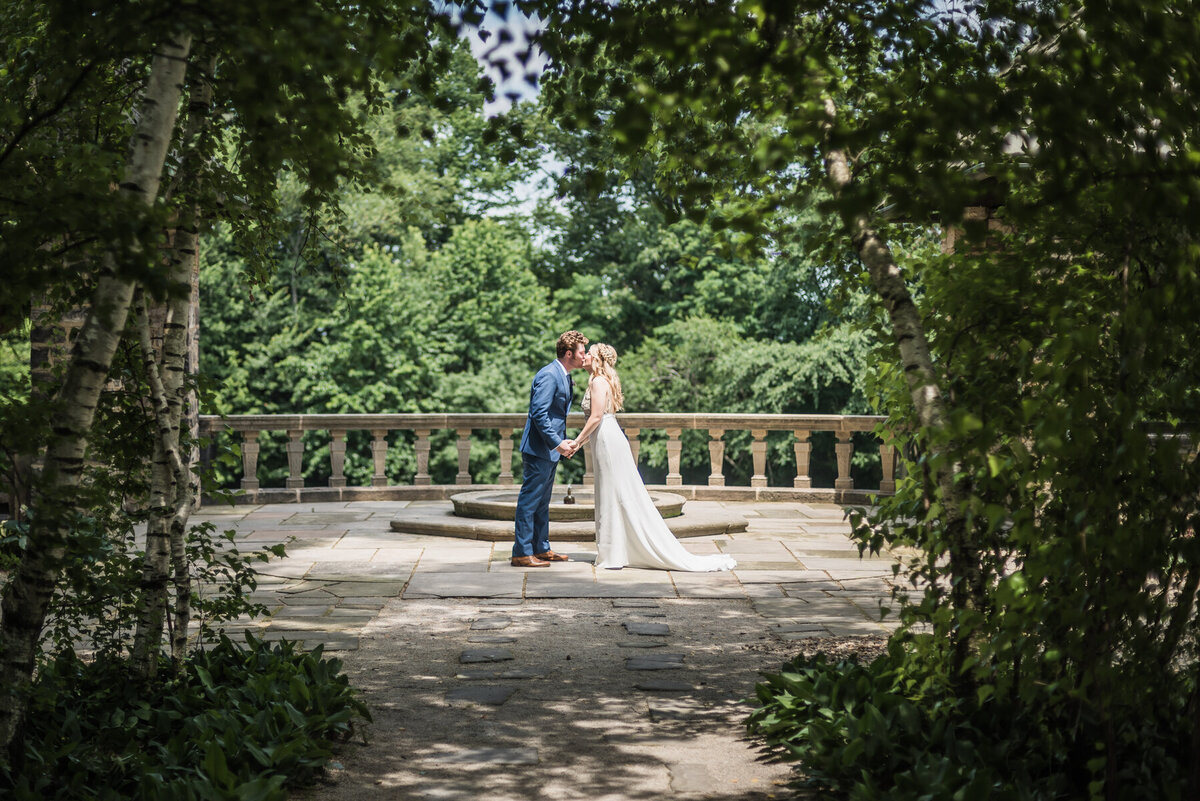 bride and groom kiss at stan hywett wedding