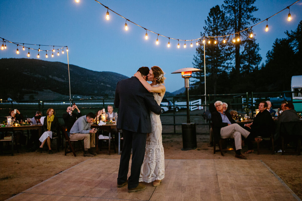 Ali and Brian slow dance under twinkle lights.