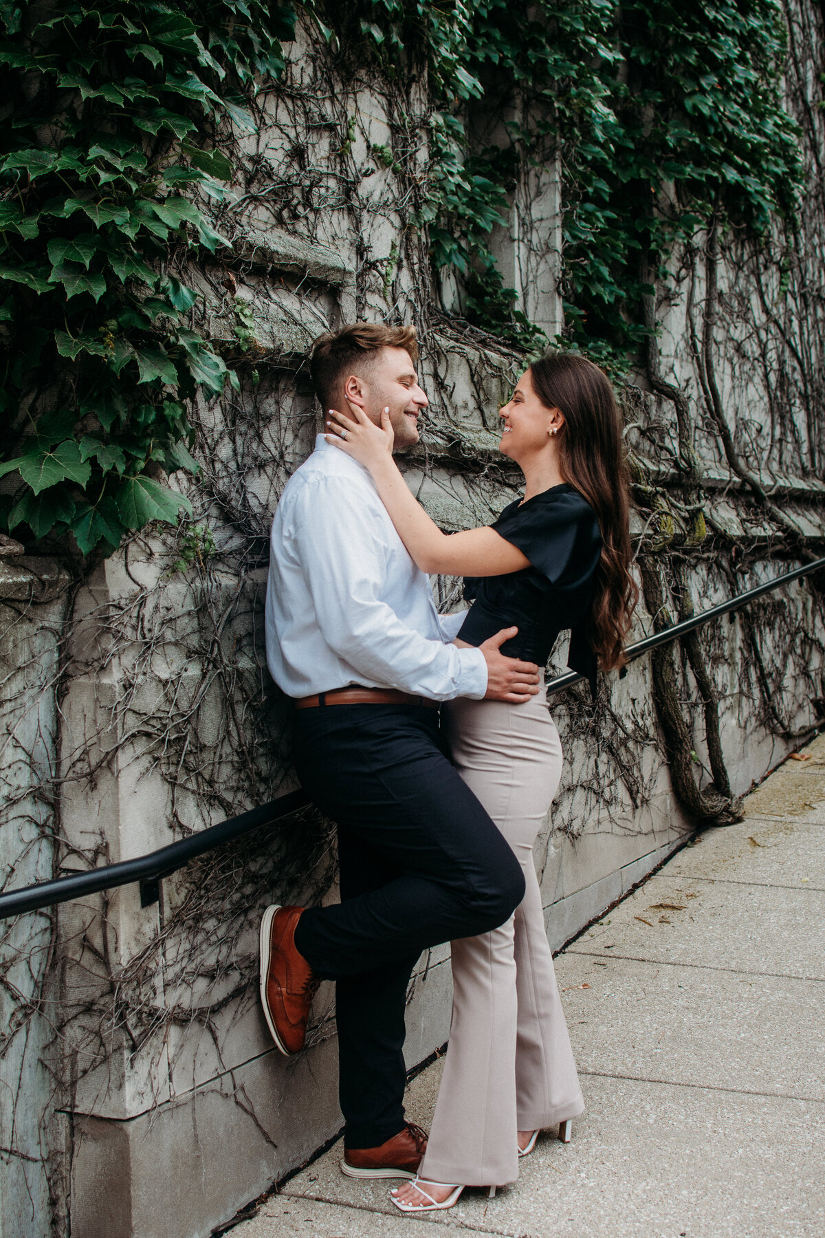 Sexy embrace between a couple during their engagement photo session in CHicago, IL