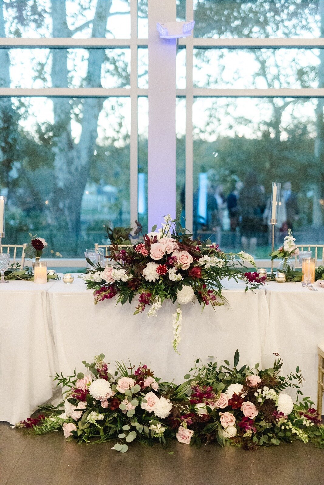 Elegant long wedding table design with colorful flowers