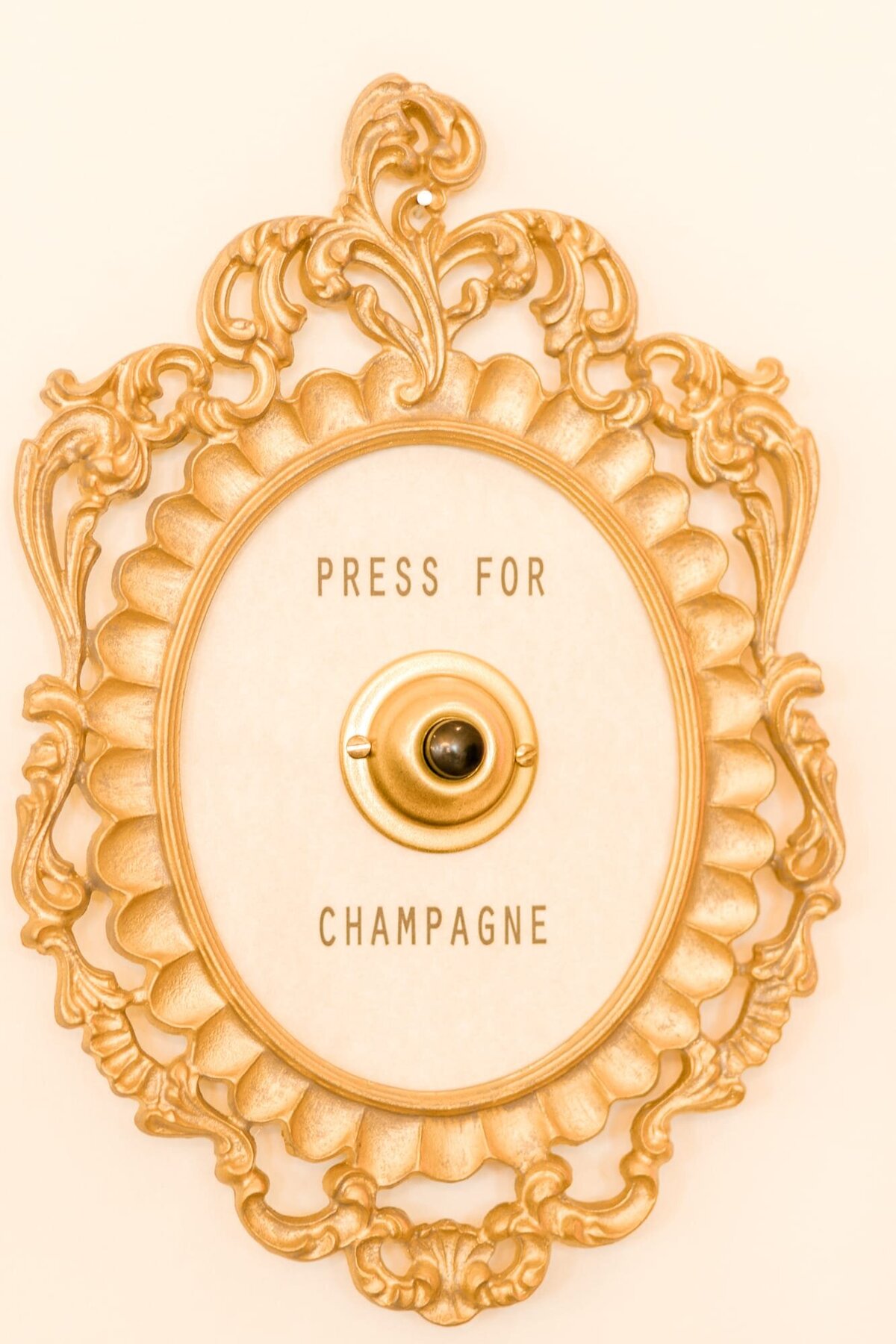 Button that says "press for champagne"