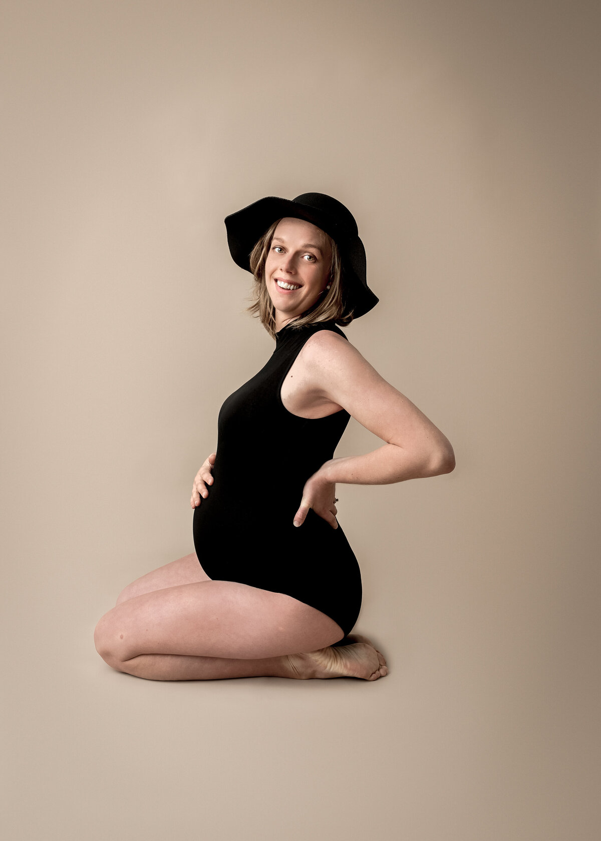 Maternity Fashion Photoshoot in a black bodysuit at a hat by Lauren Vanier Photography in Hobart Tasmania