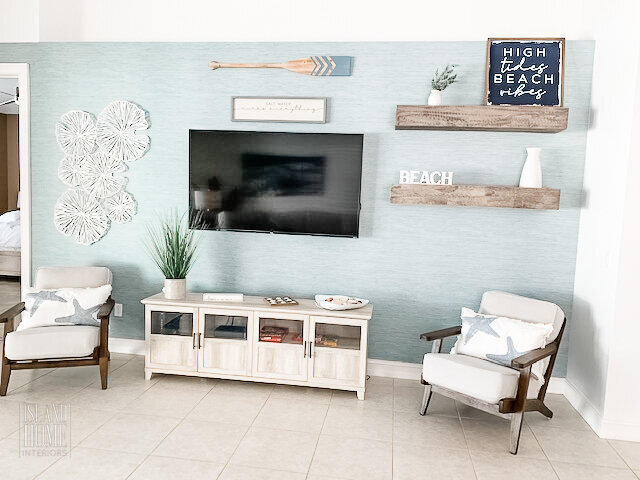 Island Home Interiors coastal living room TV Wall decor rental Distance Design Lake Nona