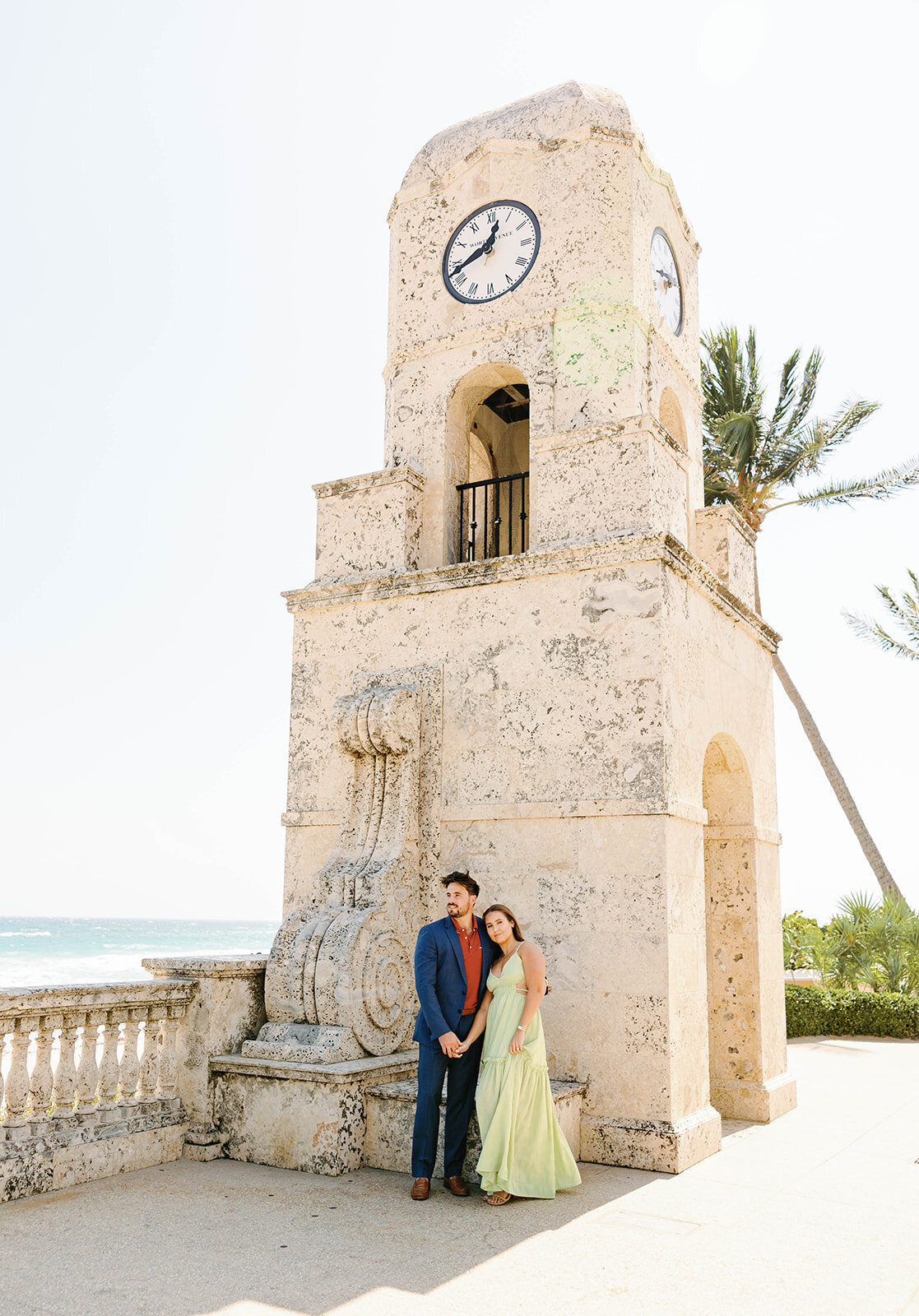 A scenic engagement session at Palm Beach’s iconic landmark, photographed by Claudia Amalia Photography.