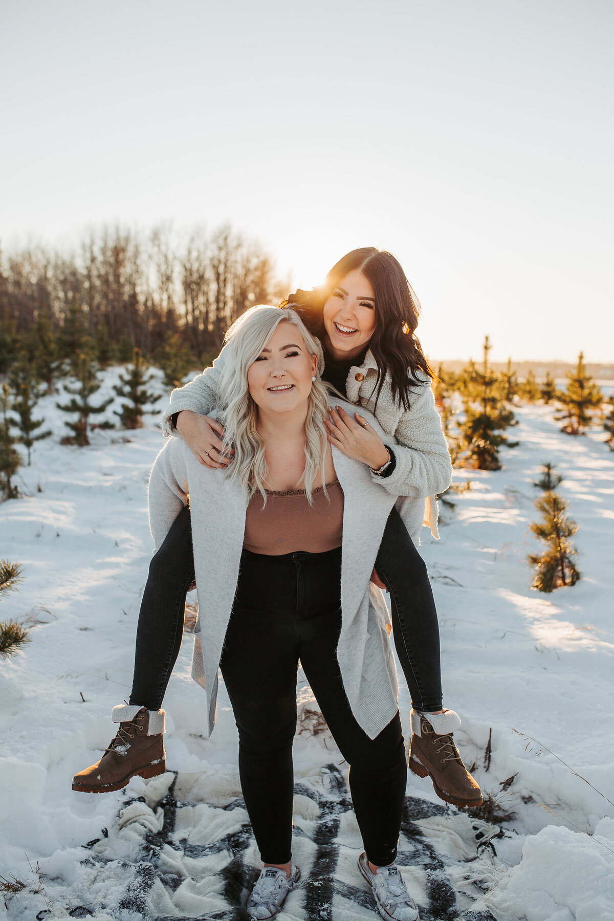 sister on other sisters back laughing