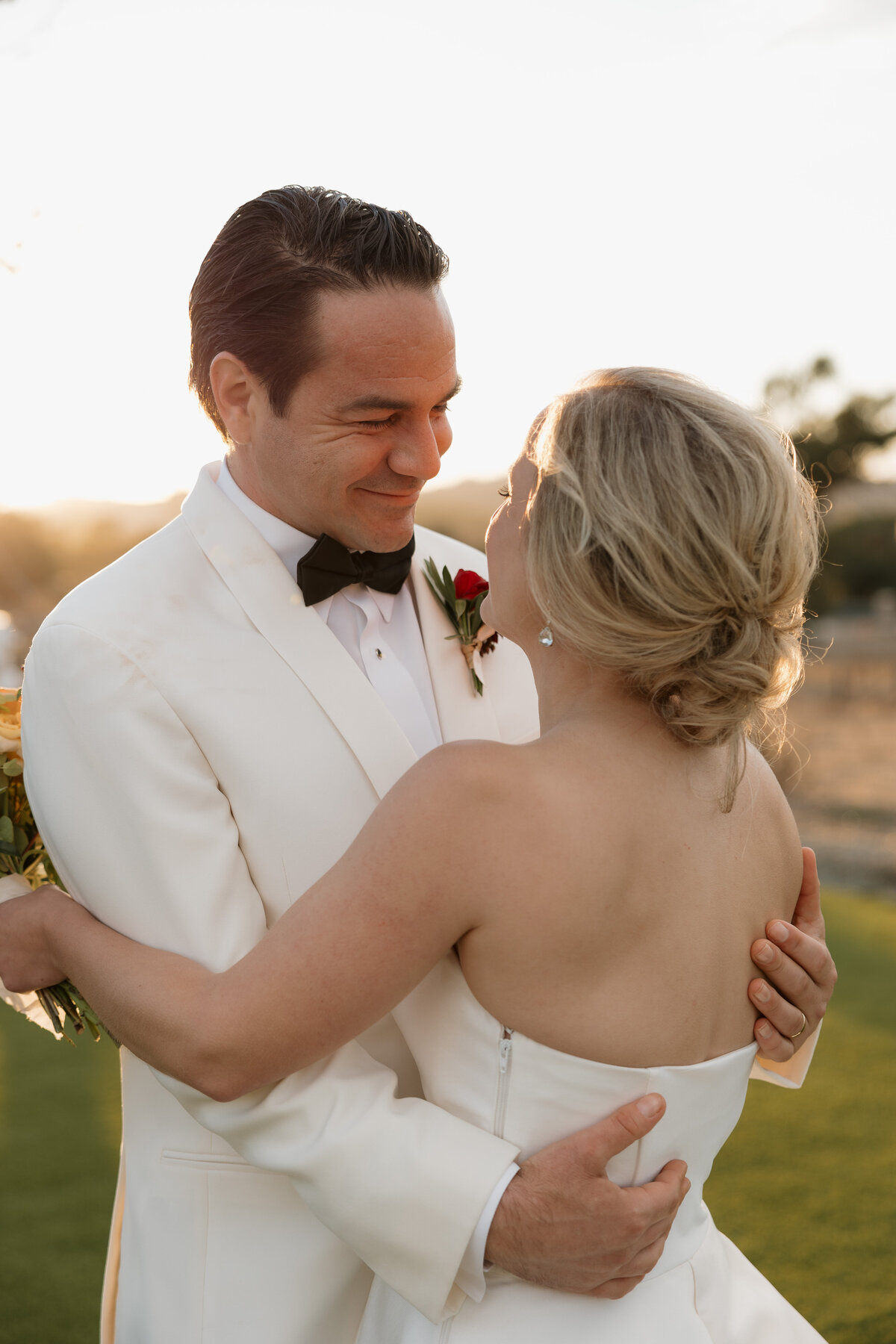 A beautiful wedding ceremony setup at Carneros Resort in Napa Valley, surrounded by lush vineyards and elegant floral arrangements.