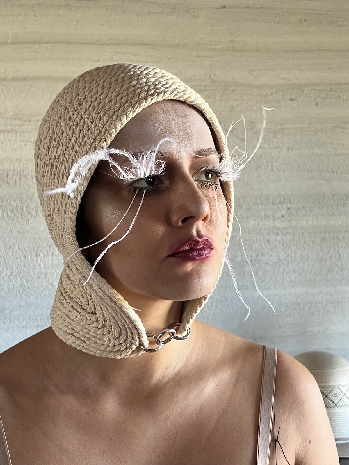 woman-feather-eyelashes-wearing-hat-makeup-film