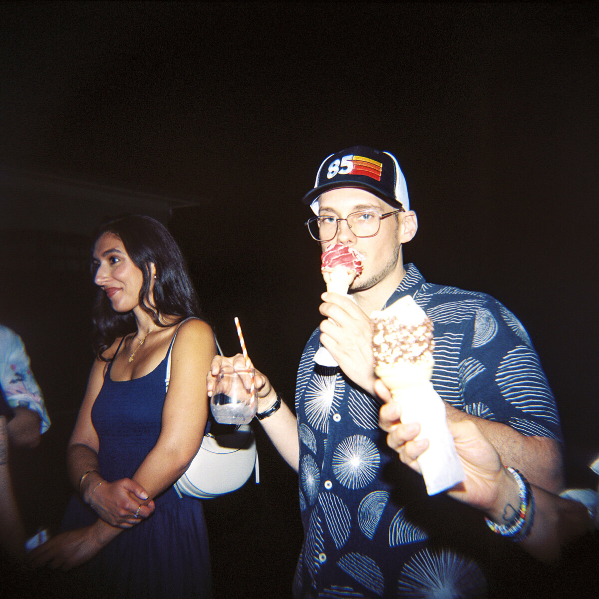 Photo of guests eating Mister Softee ice cream on film in private backyard party by Mira Park Photography NY based wedding photographer